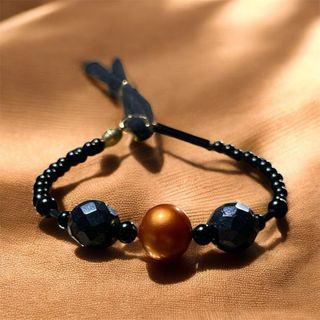Pulsera de perlas grises y naranjas