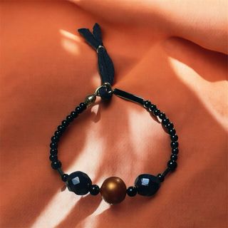 Pulsera de perlas grises y naranjas