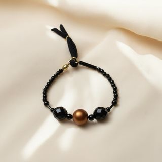 Pulsera de perlas grises y naranjas