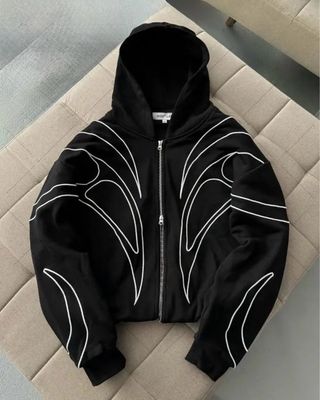 Zip tecnica nera con dettagli riflettenti