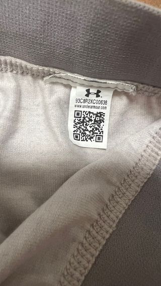 Mallas Under Armour grises con logo rosa