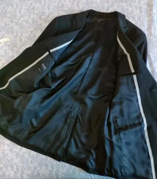 Traje negro chaqueta y pantalón