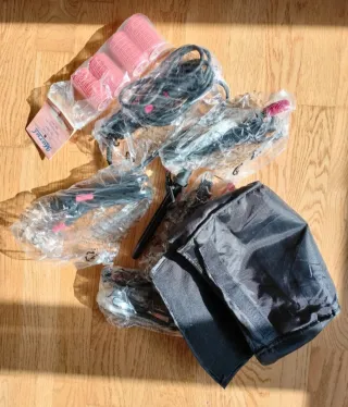 Plancha de pelo Rowenta rosa y negra