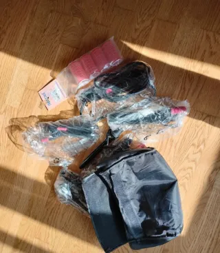 Plancha de pelo Rowenta rosa y negra