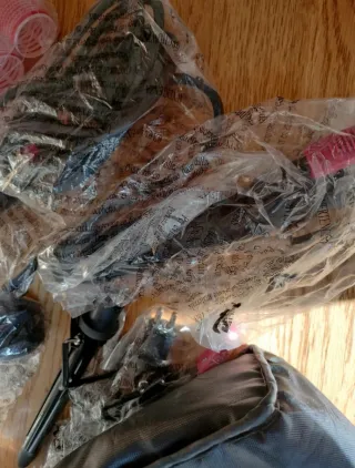 Plancha de pelo Rowenta rosa y negra