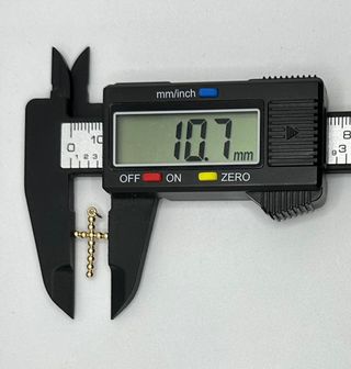 Colgante Cruz Bolas de oro de 18k, 0.56 g.