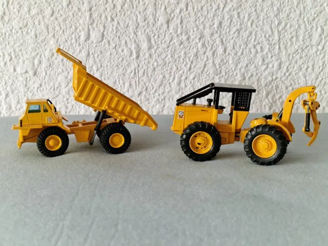 Camión volquete y tractor forestal , Caterpillar