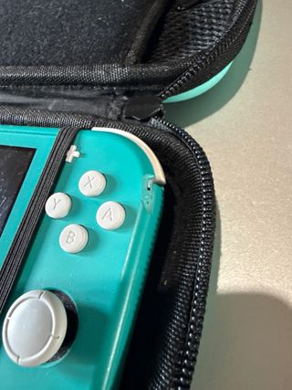 Nintendo Switch Lite + 3 Giochi + Custodia