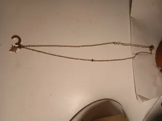 Collana con stella e luna dorata