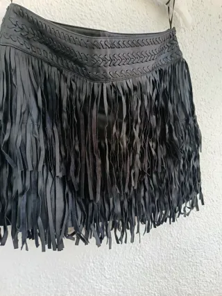 Minifalda piel y flecos