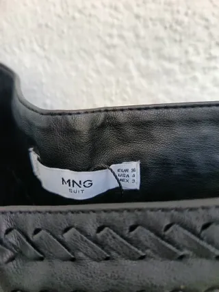 Minifalda piel y flecos