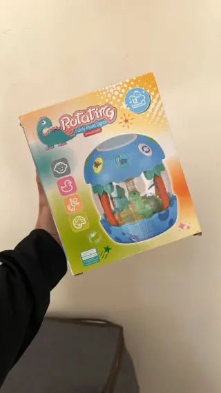 Dino Giocattolo Rotante con Luci e Musica