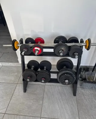 Juego de pesas y barra 1 pesa menos que en la fot