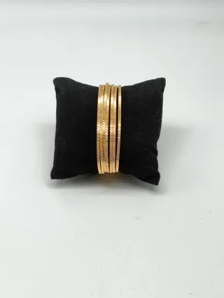 7 Pulseras Semanario con tallas oro 18kt