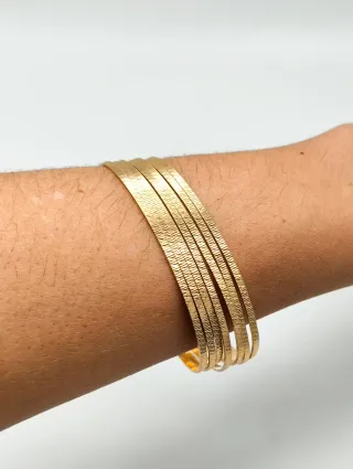 7 Pulseras Semanario con tallas oro 18kt
