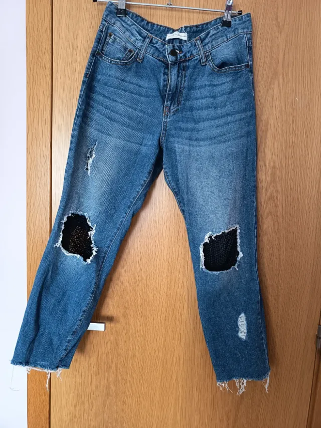 Vaqueros desgastados con parches