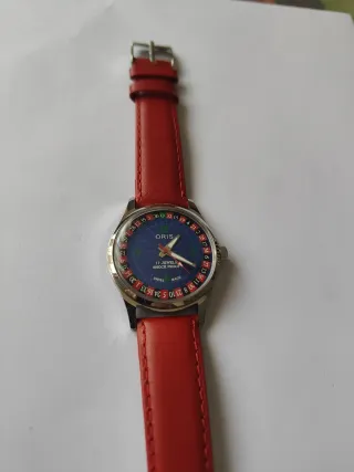 Reloj Oris de cuerda azul y rojo