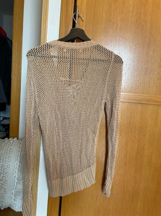 Jersey calado beige con lazo dorado