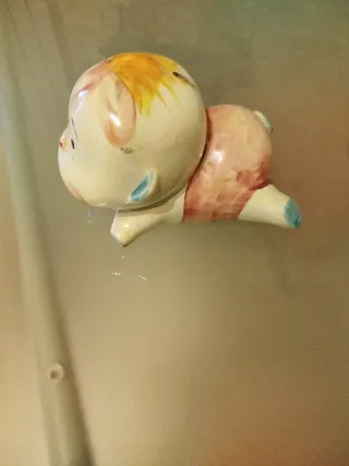 Salvadanaio bimbo in ceramica