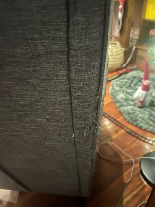 Dos sillones orejeros de tela y madera