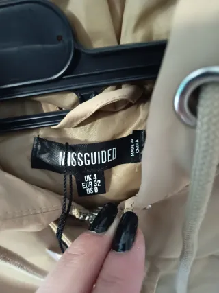 Plumas beige sin usar talla única