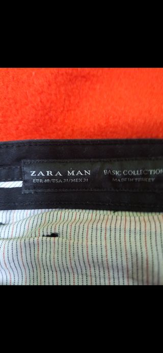 Traje negro con tela americana brillante