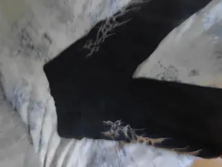 Pantalones vaqueros negros con detalles plateados