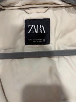 Chaleco largo con capucha beige