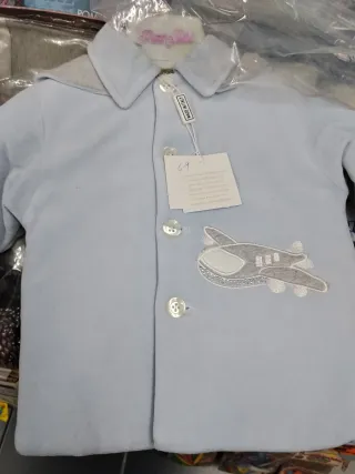 Cappottino neonato azzurro con aeroplano