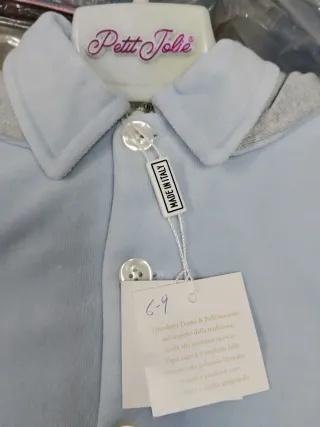 Cappottino neonato azzurro con aeroplano