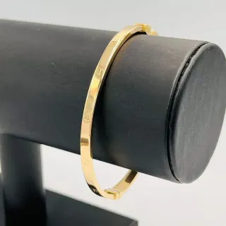 Pulsera rígida 18K con circonitas