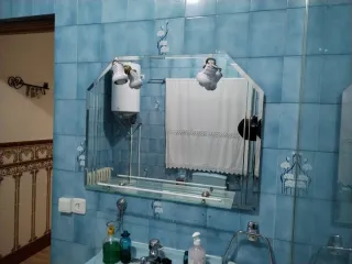 Espejo de baño cristal y metal dorado