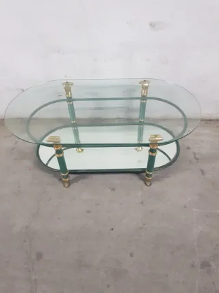Mesa de centro ovalada cristal y metal dorado