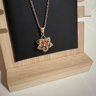 Colgante Flor Oro y Rojo - giratorio .