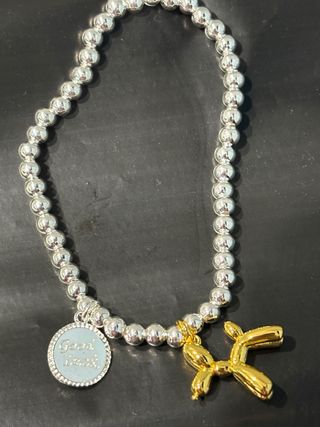 Pulsera elástica plata y oro con charm