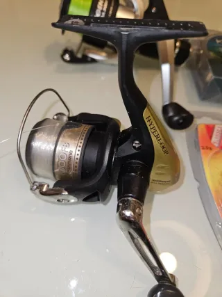 2 carretes pesca Shimano y Trabuco + línea