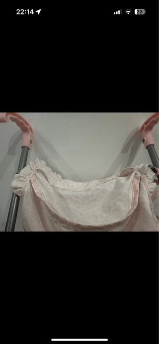 Carro de muñecas rosa