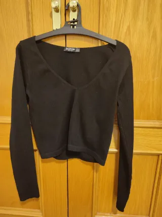 Jersey canalé Stradivarius negro