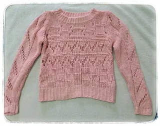 Jersey rosa tejido con detalles