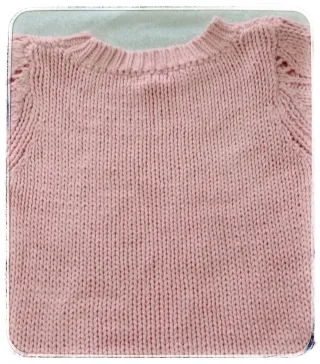 Jersey rosa tejido con detalles