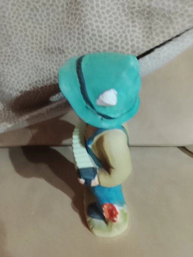 Antica statuina bambino con fisarmonica