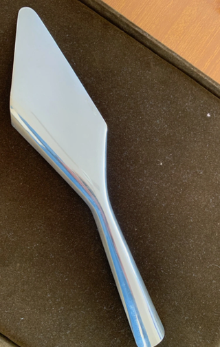 Christofle . Paletta torta Sabattini design.