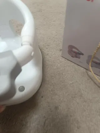 Asiento de ducha para bebé con juguetes