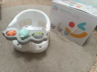 Asiento de ducha para bebé con juguetes