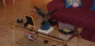 Mesa de centro cristal y metal dorado