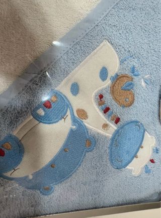 Accappatoio triangolare in spugna