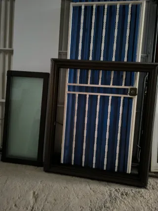 Ventana corredera con marco bronce