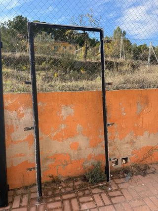 Puerta de hierro forjado maciza