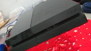 PS4 con 9 juegos y mando azul