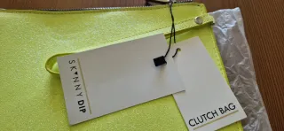 Bolso de mano Skinnydip amarillo con cara